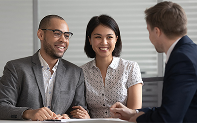 Photo of wealth advisor helping client.